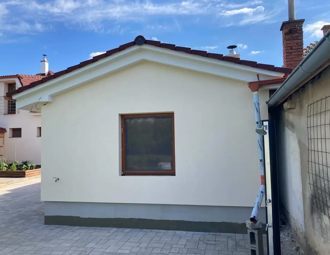 Completed light-coloured facade on a compact family home